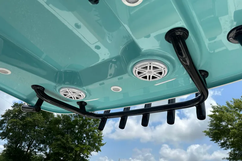 Slide: The Image of 2026 Sportsman Open 232 Center Console boat underside with speakers and rod holders. - 43