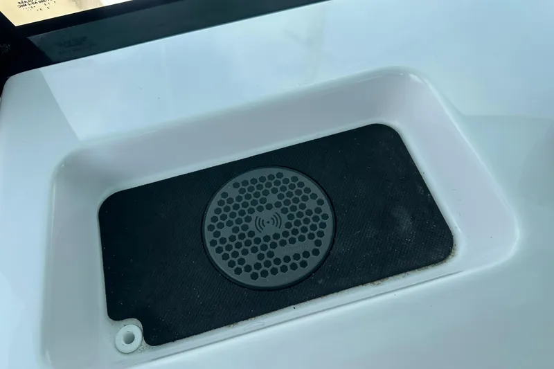 Slide: The Image of Wireless charging pad on 2026 Sportsman Open 232 Center Console boat. - 45