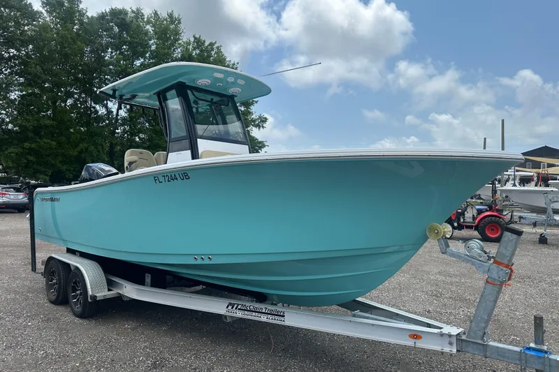Slide: The Image of 2026 Sportsman Open 232 Center Console boat on trailer, parked outdoors. - 8