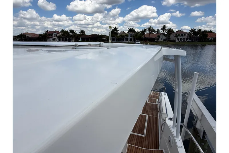 Slide: The Image of 2019 Jeanneau Leader 10.5 boat deck with scenic waterfront view. - 102