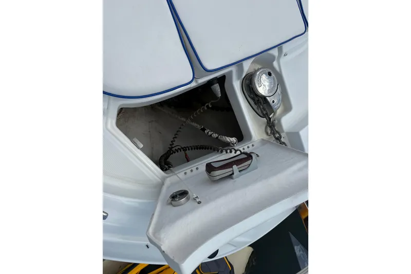 Slide: The Image of Anchor compartment of 2019 Jeanneau Leader 10.5 boat with visible chain and winch. - 105