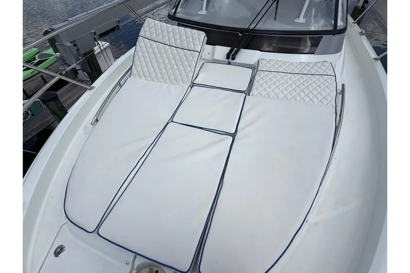 Slide: The Image of 2019 Jeanneau Leader 10.5 boat with cushioned deck, docked by the water. - 106