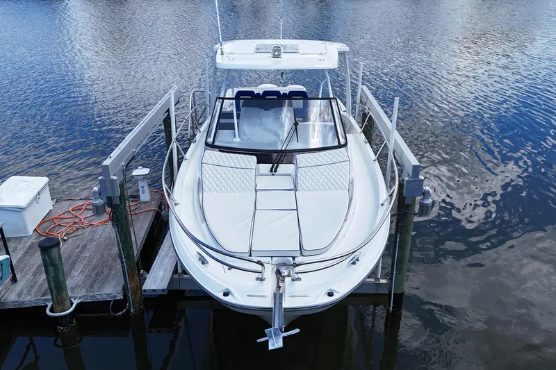 Slide: The Image of 2019 Jeanneau Leader 10.5 boat docked on calm water. - 14