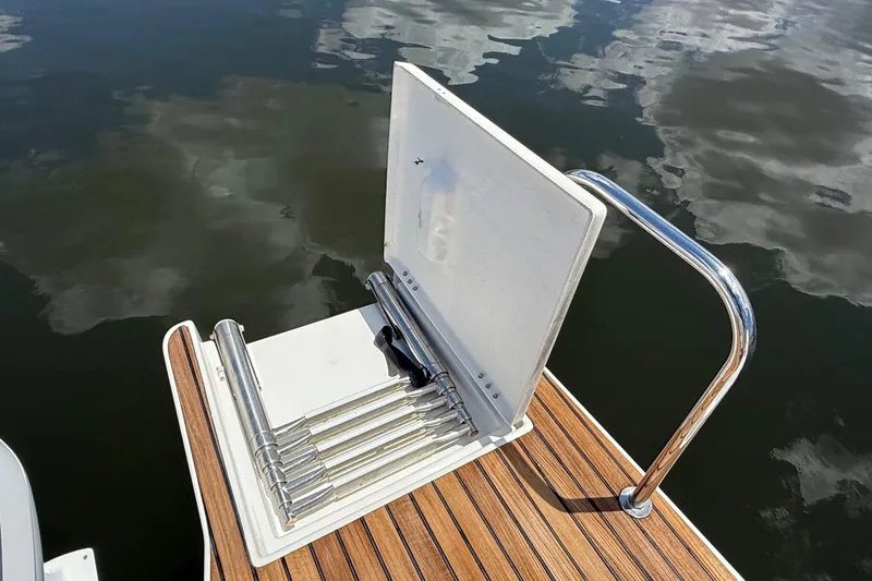 Slide: The Image of 2019 Jeanneau Leader 10.5 swim platform with retractable ladder and stainless steel railing. - 21