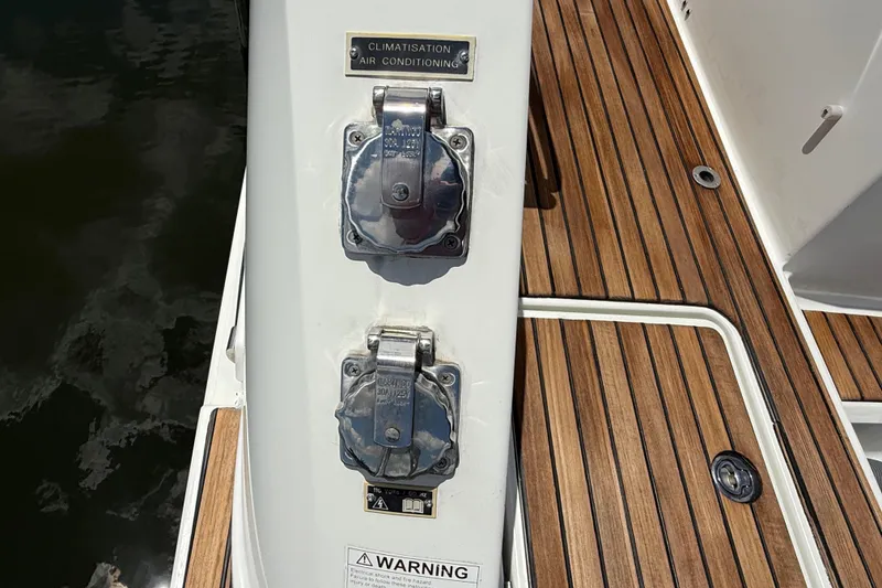 Slide: The Image of 2019 Jeanneau Leader 10.5 boat deck with air conditioning outlets and teak flooring. - 22