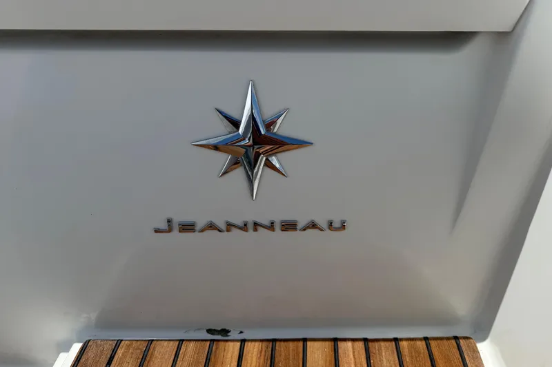 Slide: The Image of Jeanneau Leader 10.5 2019 boat emblem with star logo on white background. - 26