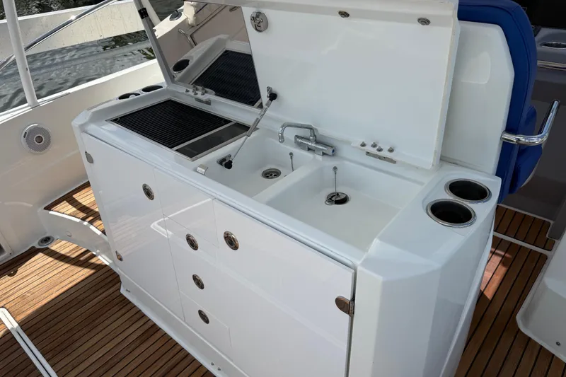 Slide: The Image of Outdoor kitchenette on 2019 Jeanneau Leader 10.5 yacht with sink and grill. - 42
