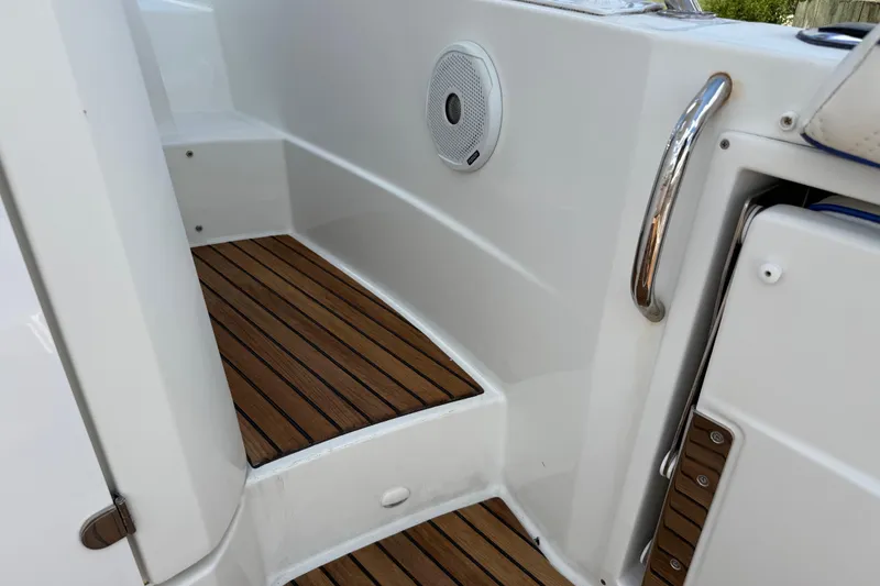 Slide: The Image of 2019 Jeanneau Leader 10.5 boat interior with teak flooring and stainless steel handrail. - 44