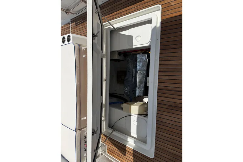 Slide: The Image of Engine compartment of 2019 Jeanneau Leader 10.5 boat with wooden deck. - 46