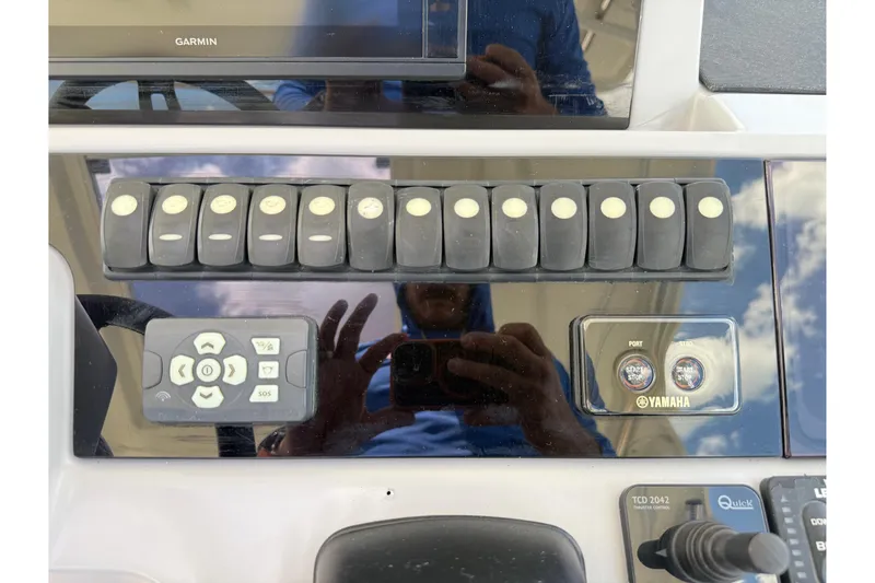 Slide: The Image of Control panel of a 2019 Jeanneau Leader 10.5 boat with Yamaha start buttons. - 55