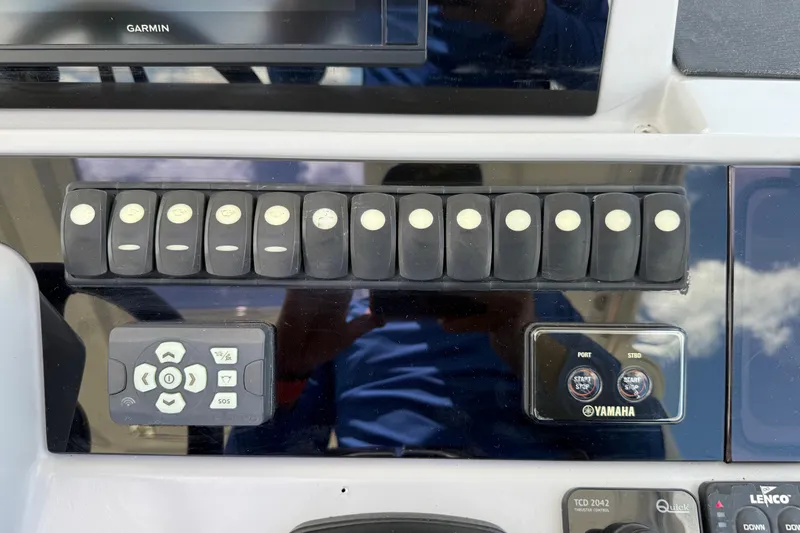 Slide: The Image of Control panel of a 2019 Jeanneau Leader 10.5 boat with Yamaha start-stop buttons. - 59