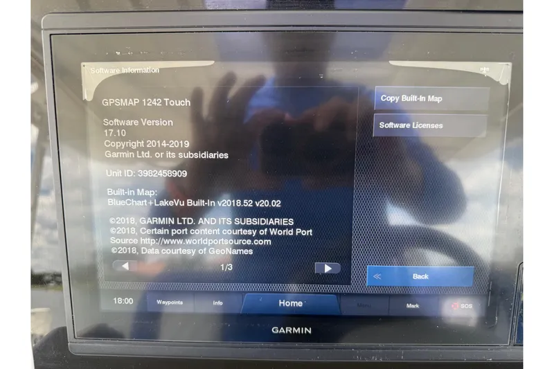 Slide: The Image of Garmin GPSMAP 1242 Touch display on 2019 Jeanneau Leader 10.5 boat, showing software information. - 64