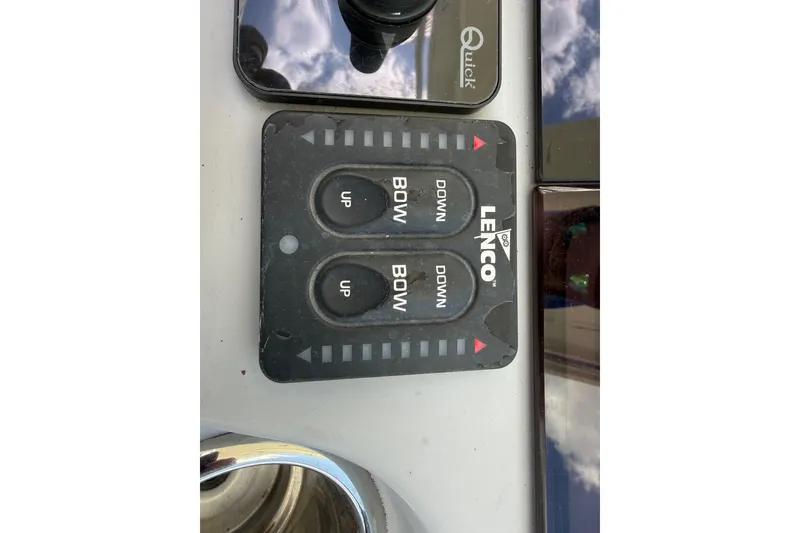 Slide: The Image of Control panel of a 2019 Jeanneau Leader 10.5 boat with Lenco trim tab switches. - 67