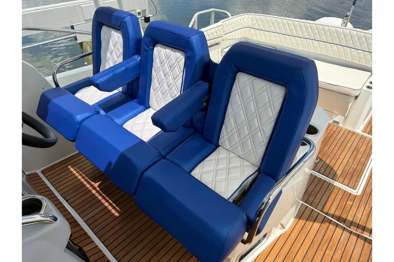 Slide: The Image of Luxurious blue and white seating on 2019 Jeanneau Leader 10.5 boat deck. - 72