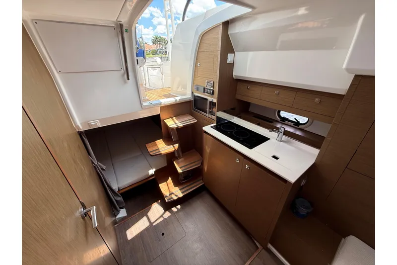 Slide: The Image of Interior of 2019 Jeanneau Leader 10.5 yacht with modern kitchen and seating area. - 73