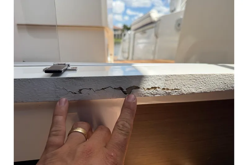 Slide: The Image of Cracked surface on 2019 Jeanneau Leader 10.5 boat, highlighting damage detail. - 74