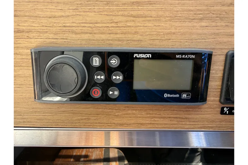 Slide: The Image of Fusion MS-RA70N stereo system on 2019 Jeanneau Leader 10.5 boat, featuring Bluetooth connectivity. - 77