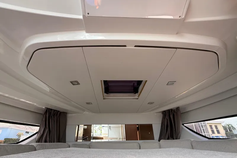Slide: The Image of Interior view of 2019 Jeanneau Leader 10.5 yacht, featuring modern ceiling design and windows. - 87