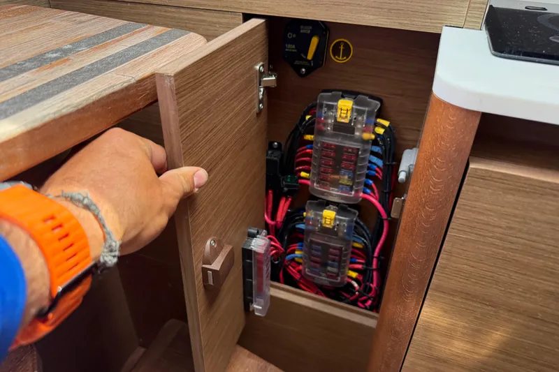 Slide: The Image of Electrical panel inside a 2019 Jeanneau Leader 10.5 boat cabinet. - 97