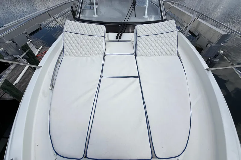 Slide: The Image of 2019 Jeanneau Leader 10.5 boat with spacious white sunbathing cushions on deck. - 98