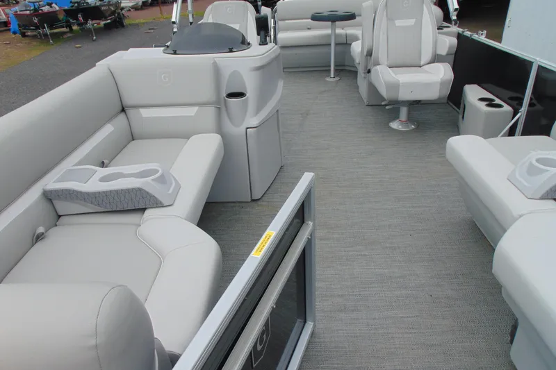 Slide: The Image of 2024 Godfrey Sweetwater 2086 C pontoon boat interior with plush seating and modern design. - 10