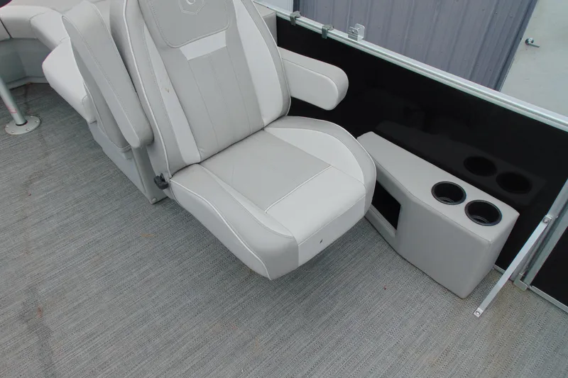 Slide: The Image of 2024 Godfrey Sweetwater 2086 C boat interior with plush seating and cup holders. - 14