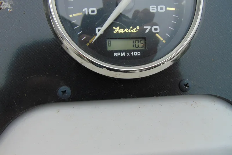 Slide: The Image of Close-up of a Faria tachometer on a 2024 Godfrey Sweetwater 2086 C boat. - 17