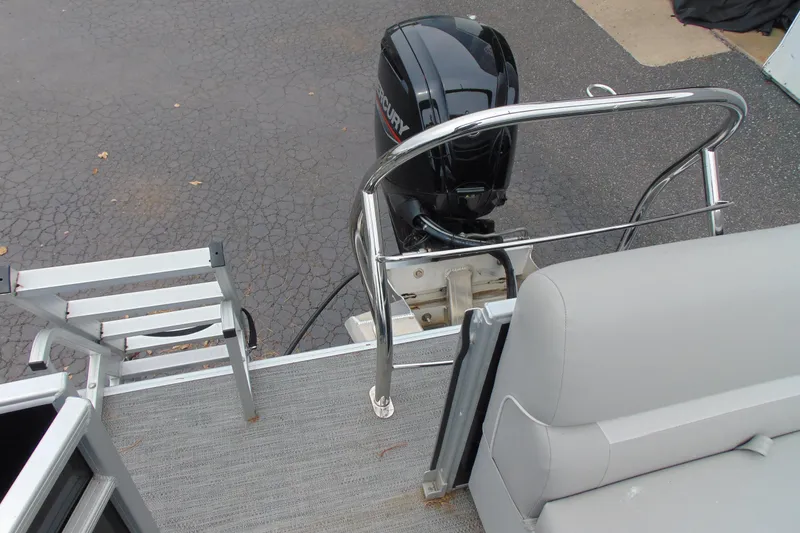 Slide: The Image of 2024 Godfrey Sweetwater 2086 C pontoon boat with motor and ladder. - 19