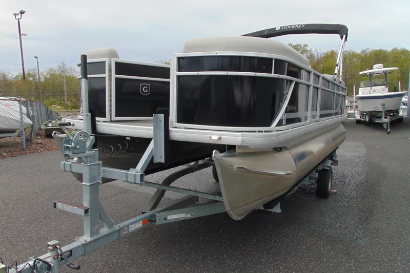 Slide: The Image of 2024 Godfrey Sweetwater 2086 C pontoon boat on trailer in parking lot. - 4