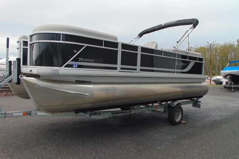 Slide: The Image of 2024 Godfrey Sweetwater 2086 C pontoon boat on trailer, black and silver design. - 5