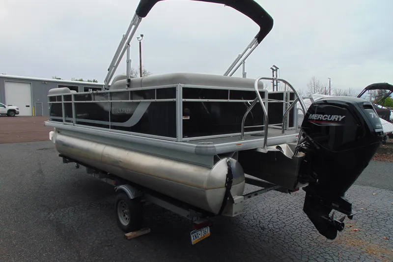 Slide: The Image of 2024 Godfrey Sweetwater 2086 C pontoon boat with Mercury outboard motor on trailer. - 6