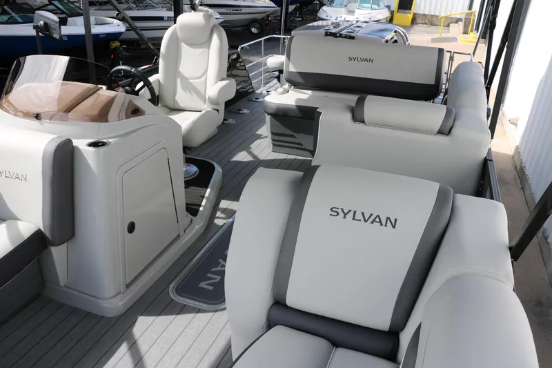 Slide: The Image of 2025 Sylvan MIRAGE X3 DLZ BAR pontoon boat interior with luxurious seating. - 11