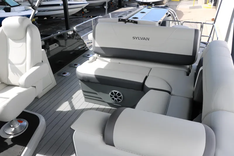 Slide: The Image of Luxurious interior of 2025 Sylvan MIRAGE X3 DLZ BAR pontoon boat with plush seating. - 13
