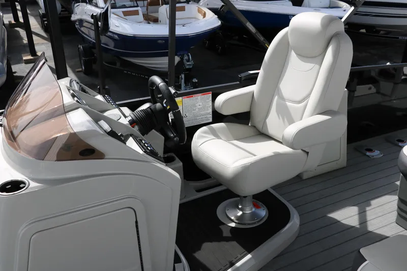 Slide: The Image of Captain's chair and helm of 2025 Sylvan MIRAGE X3 DLZ BAR boat. - 14