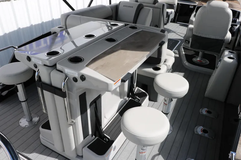 Slide: The Image of 2025 Sylvan MIRAGE X3 DLZ BAR interior with bar seating and modern design. - 17