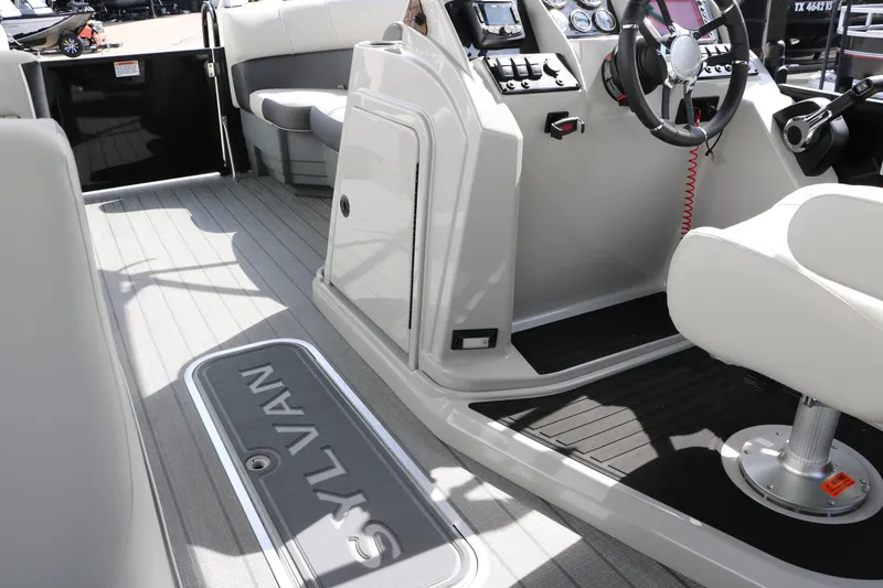 Slide: The Image of Interior view of 2025 Sylvan MIRAGE X3 DLZ BAR boat, featuring sleek design and modern controls. - 22