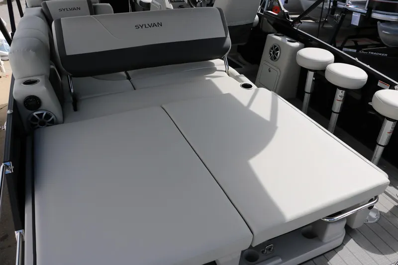 Slide: The Image of 2025 Sylvan MIRAGE X3 DLZ BAR boat interior with plush seating and modern design. - 29