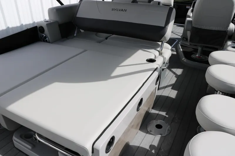 Slide: The Image of 2025 Sylvan MIRAGE X3 DLZ BAR boat interior with luxurious seating and modern design. - 31