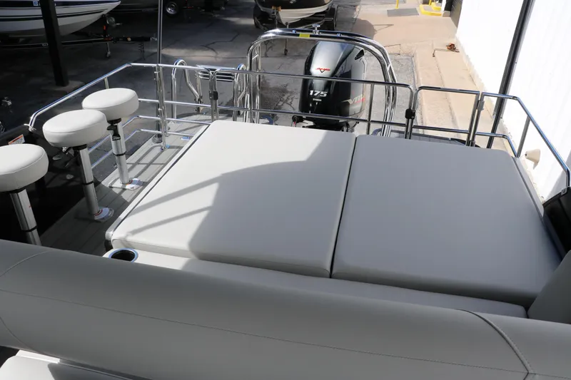 Slide: The Image of 2025 Sylvan MIRAGE X3 DLZ BAR boat interior with seating and motor view. - 32