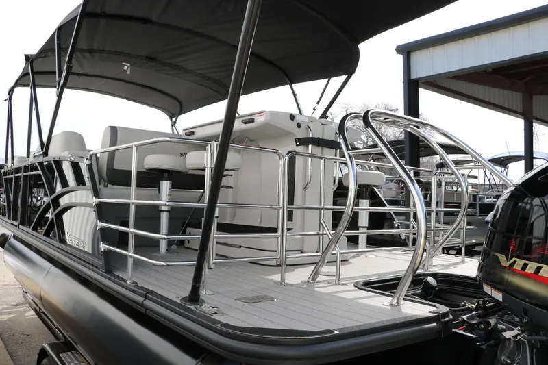 Slide: The Image of 2025 Sylvan MIRAGE X3 DLZ BAR pontoon boat with sleek design and modern seating. - 6