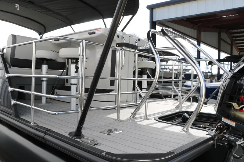 Slide: The Image of 2025 Sylvan MIRAGE X3 DLZ BAR pontoon boat with sleek railing and seating. - 7