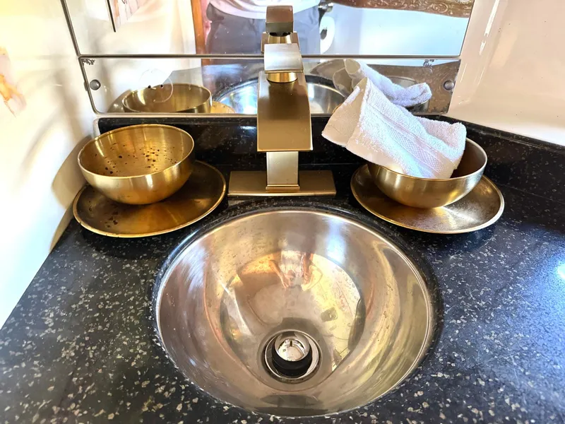 Slide: The Image of Luxury bathroom sink with brass fixtures on a 2001 Carver 396 Motor Yacht. - 26