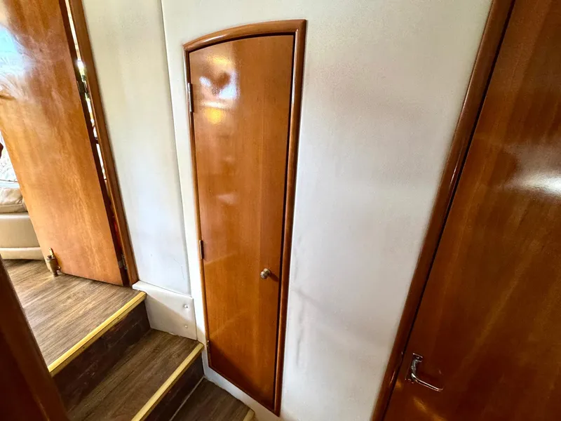 Slide: The Image of Interior of 2001 Carver 396 Motor Yacht with wooden doors and steps. - 28