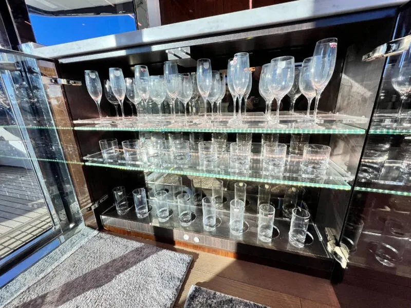 Slide: The Image of Glassware cabinet on Fairline Squadron 68 yacht, 2020 model, with champagne flutes and tumblers. - 15