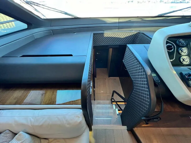 Slide: The Image of Interior of 2020 Fairline Squadron 68 yacht, featuring modern helm and staircase. - 20