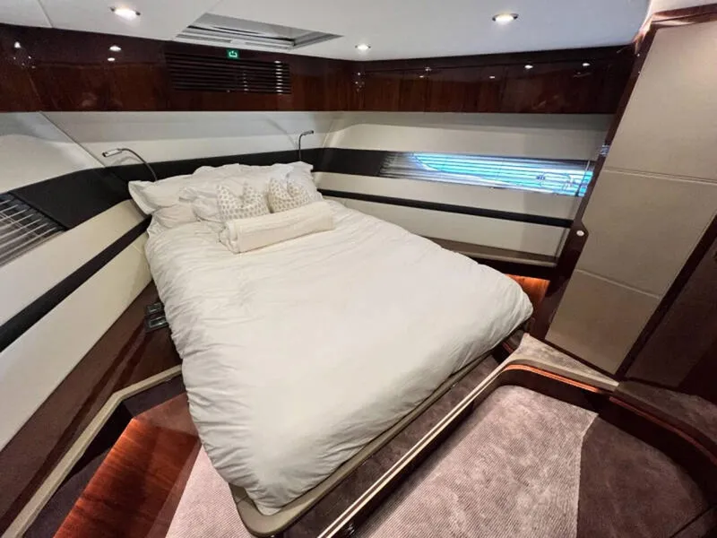 Slide: The Image of Luxurious bedroom interior of 2020 Fairline Squadron 68 yacht with elegant bedding and modern design. - 24