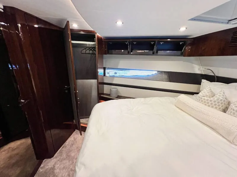 Slide: The Image of Luxurious bedroom interior of 2020 Fairline Squadron 68 yacht with elegant wood finishes. - 27