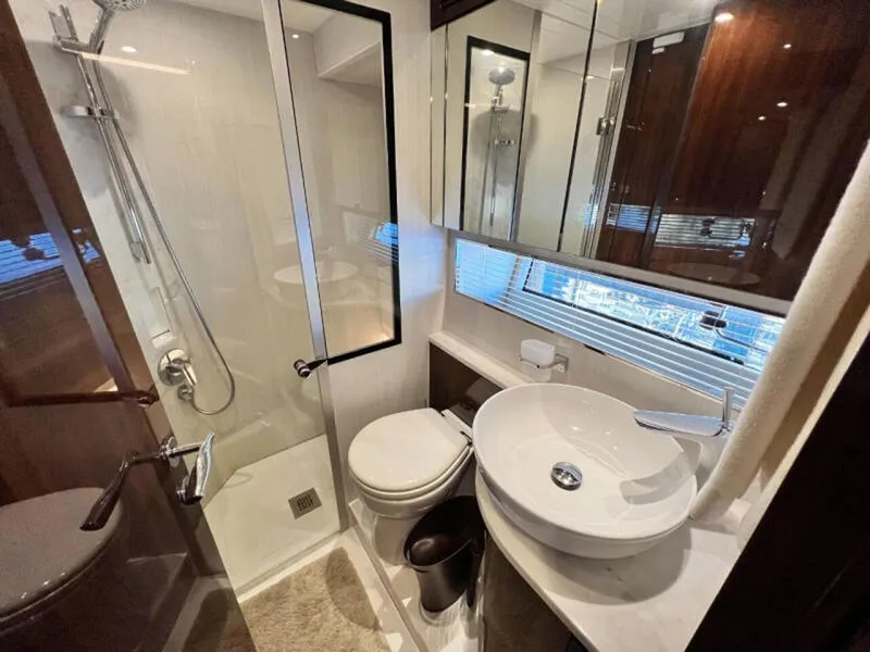 Slide: The Image of Luxurious bathroom in 2020 Fairline Squadron 68 yacht, featuring modern fixtures and elegant design. - 29