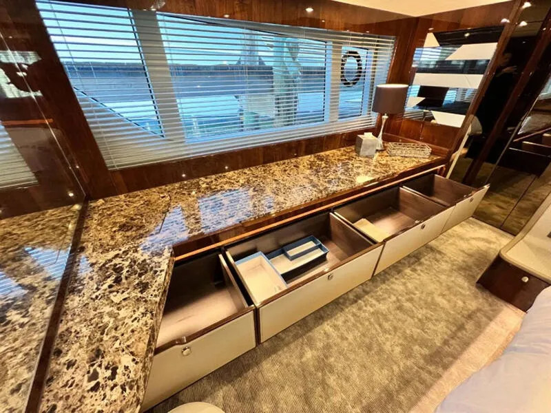 Slide: The Image of Luxurious interior of 2020 Fairline Squadron 68 yacht with marble countertop and ample storage. - 44