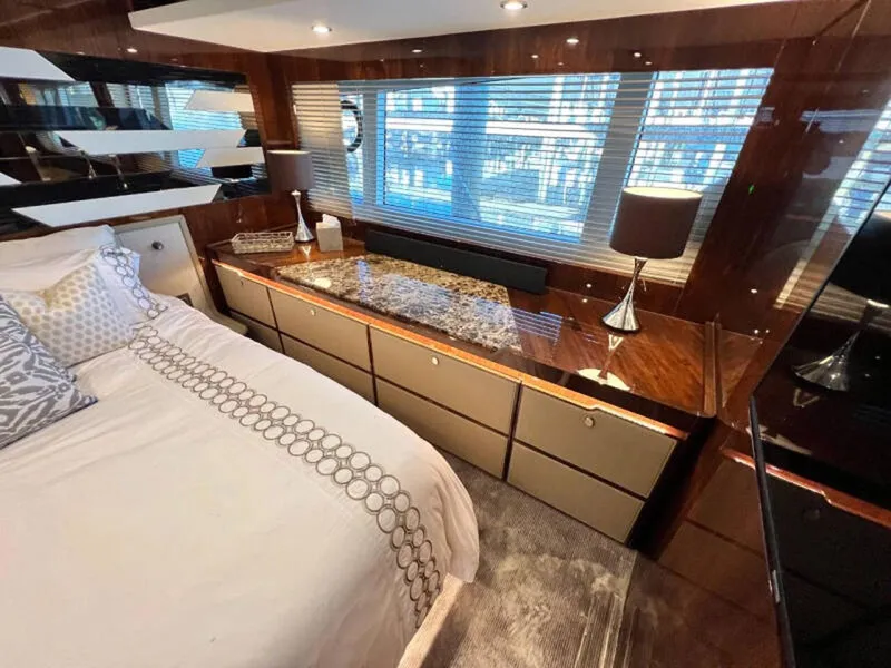 Slide: The Image of Luxurious bedroom interior of 2020 Fairline Squadron 68 yacht with elegant decor and ample natural light. - 46